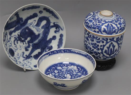 A Chinese Kangxi period blue and white U-shaped jar and cover, height 15cm, together with a Chinese blue and white bowl and a dish